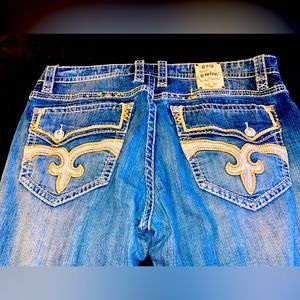 Mens Rock Revival Jeans. Size 42. Color blue with silver/orange stitching